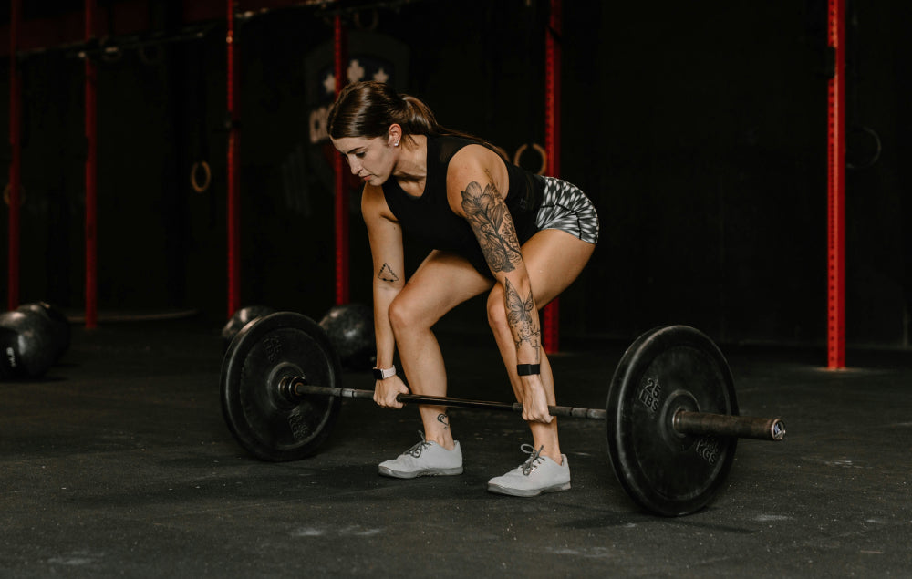 Rowing barre : l’exercice clé pour un dos puissant